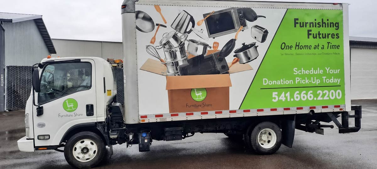 Furniture Share donation pickup truck parked outside the Albany donation center